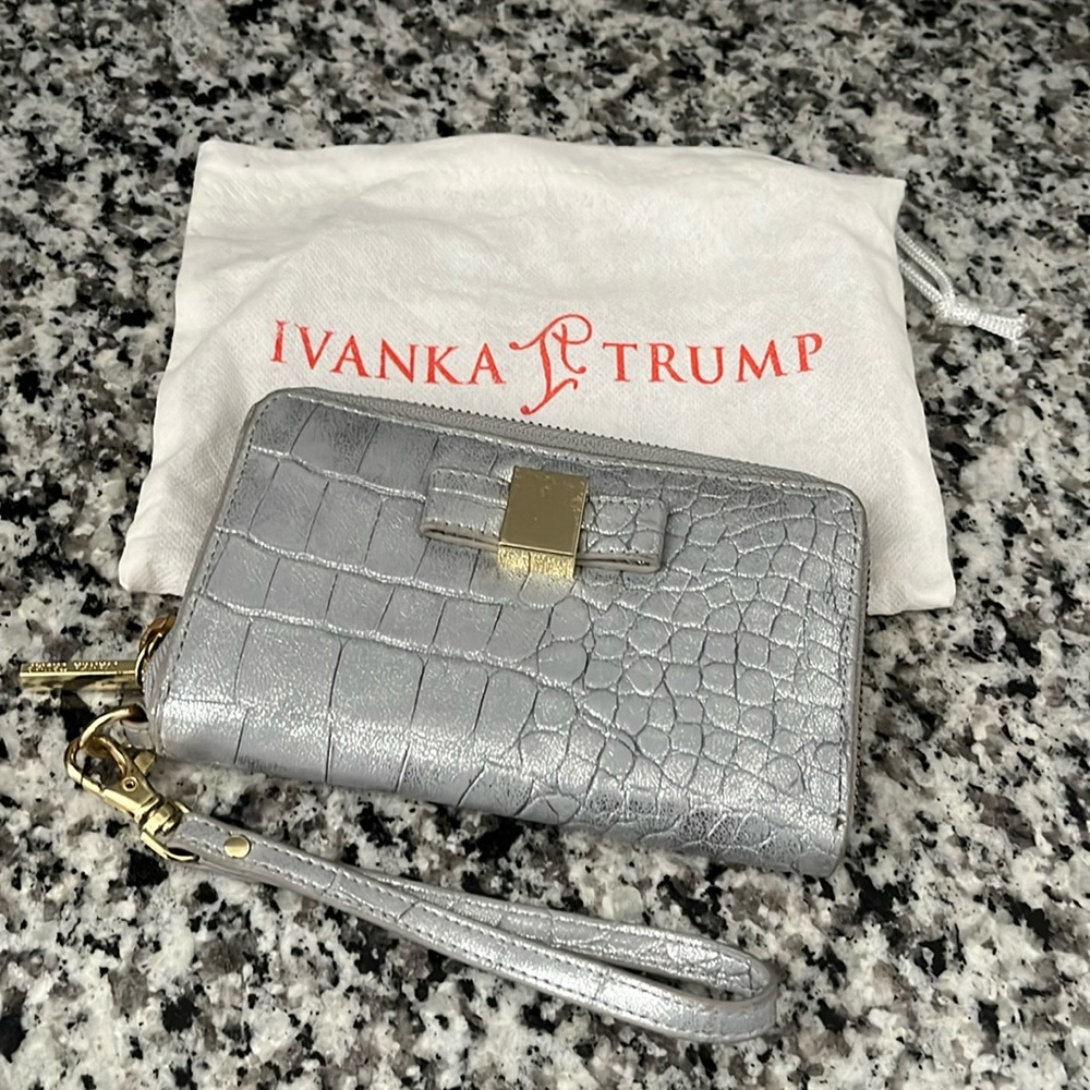 Ivanka Trump silver embossed wristlet with tag and dust bag